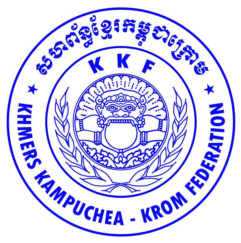 A round blue seal with Khmer and English lettering around a central emblem of a guardian face.