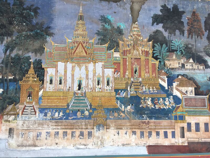 A colorful wall painting of golden palaces and figures beside water.